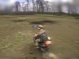 Russian soldier riding a motorcycle moments before being struck by an FPV drone.