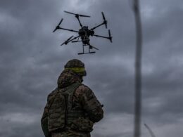 A Ukrainian soldier with a drone.