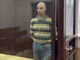 Australian national Oscar Jenkins stands in a glass cage after sentencing by a Russian kangaroo court in occupied Luhansk. Photo: "LNR" prosecutor’s office