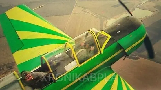 A Ukrainian Yakovlev Yak-52 with a backseat anti-drone gunner.