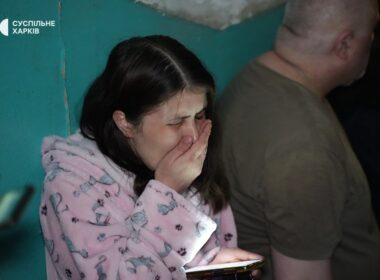 A Ukrainian woman is crying after she survived the Russian attack on her apartment building in Kharkiv on 11 June.