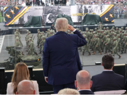 US President Donald Trump salutes a column of American military personnel during a military parade marking the 250th anniversary of the US Army.