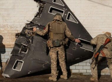 two russian drones cross nato airspace again — poland says it’s fine response needed ukrainian soldiers stand near downed shahed-136 kamikaze drone shahed shot down1 violations came same night russia