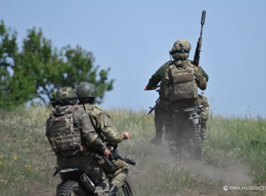 Russian soldiers on motorcycles.