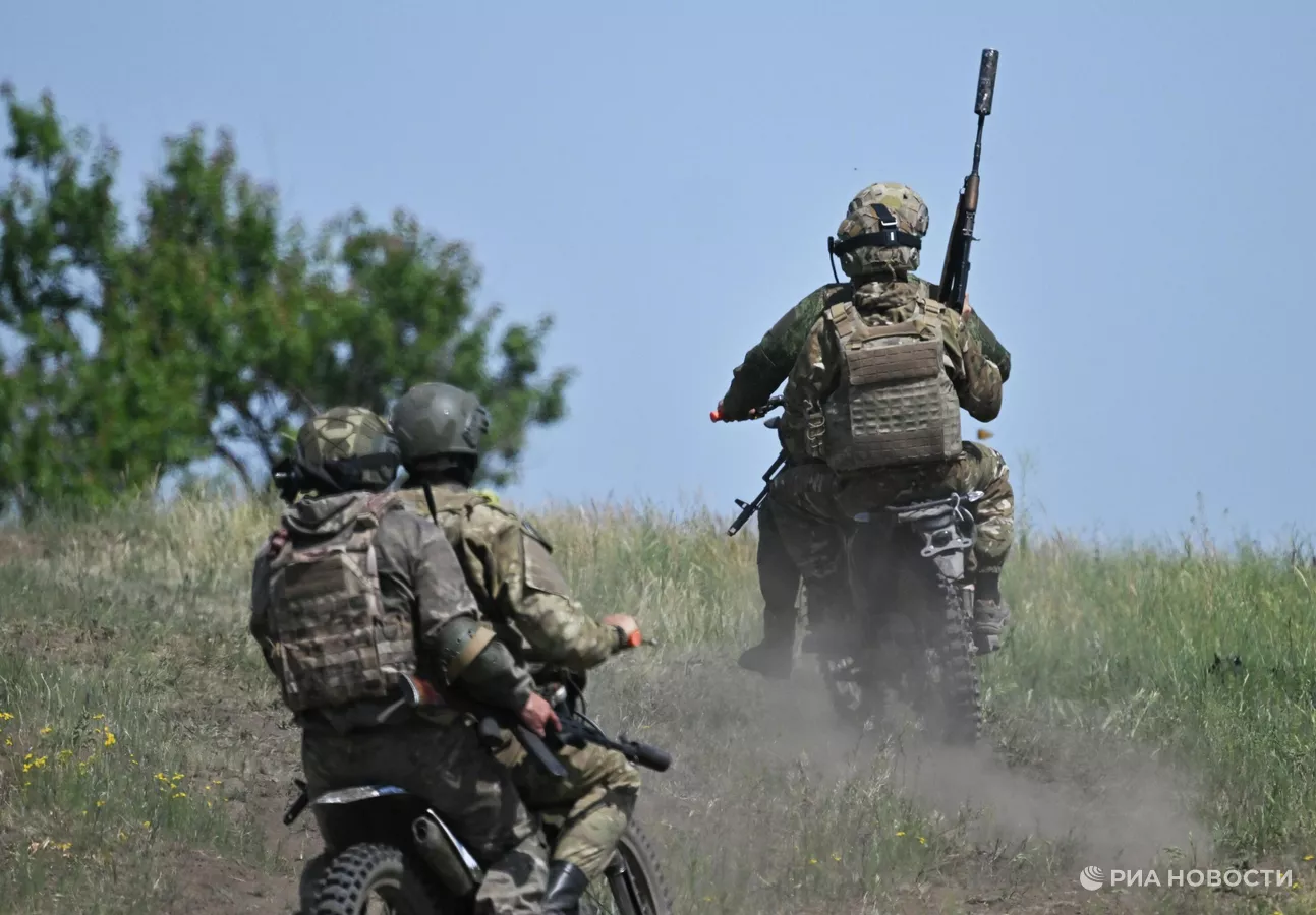 Russian soldiers on motorcycles.